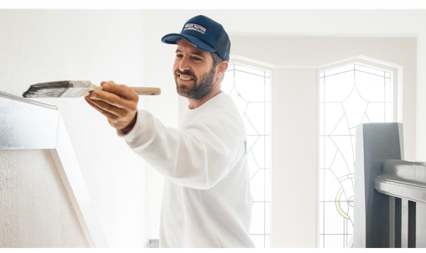 worker painting building interior